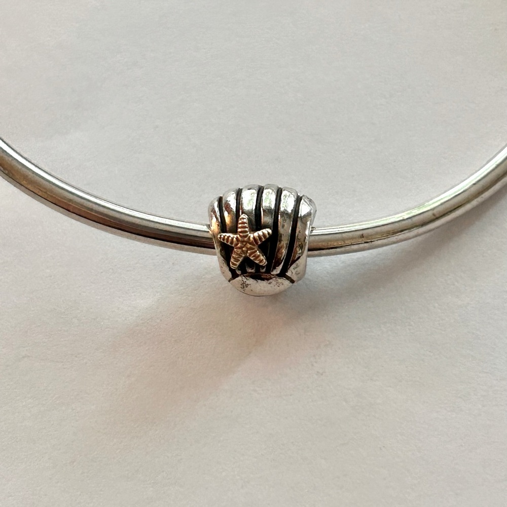 Authentic Pandora sea shell with starfish - silver & gold